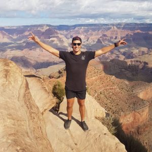 Corey Micari standing tall at the Grand Canyon